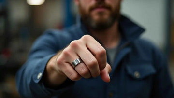 Mechanic's hand showing tungsten ring in the ring finger